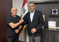 بنر استقبال از منصوریان در موصل با لباس کردی